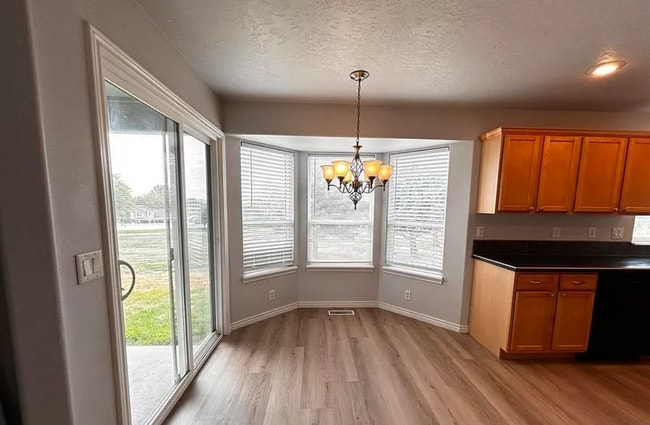 Kitchen with nook - 8455 W Harmonica Way