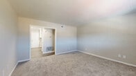 Located at 1839 Fellowship Rd in Tucker, GA, this single-story, 3-bedroom, 2-bathroom home offers a practical and well-organized layout across a comfortable footprint. The combined living and dining area is bright and open, featuring neutral carpet, soft wall tones, and a window that invites natural light. The kitchen is a standout space, outfitted with white shaker-style cabinetry, granite countertops, wood-look flooring, and stainless steel appliances including a refrigerator and range with overhead ventilation. The primary bedroom is a generously sized retreat with a ceiling fan, a large window overlooking greenery, a walk-in closet, and direct access to a secondary room or en-suite area. The two additional bedrooms are carpeted with neutral walls, natural light from windows, and sliding-door closets for ample storage. The bathrooms are clean and functional, each featuring a tub-shower combination with tiled surround and a window for ventilation. Throughout the home, four closets provide excellent storage options. A dedicated laundry room and two utility spaces add further practicality to the layout, rounding out this well-appointed Tucker residence.