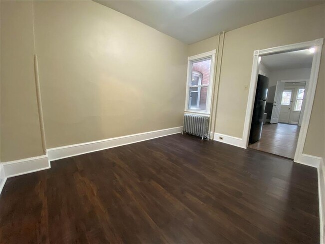 Building Photo - Charming three-bedroom row house available...