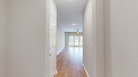 This 770 square foot apartment in Oklahoma City offers a thoughtful blend of comfort and functionality. The single-story layout comprises one bedroom, measuring 140 square feet, and one bathroom. The heart of the home is an open-concept kitchen and living area, creating a spacious feel within the compact footprint.

Throughout the apartment, warm wood flooring adds character and warmth, contrasting beautifully with the neutral wall tones. The kitchen boasts modern white cabinetry, stainless steel appliances, and a distinctive hexagonal tile backsplash. A full-size refrigerator, built-in microwave, and range provide all essential amenities for culinary endeavors.

The bedroom features a large window with blinds, allowing for abundant natural light and privacy control. A ceiling fan enhances air circulation and comfort. The bathroom is efficiently designed with a single vanity, modern fixtures, and continues the wood flooring theme.

Storage solutions include a dedicated closet space with wire shelving and an entrance hallway for additional organization. The living area is highlighted by a trio of French doors, flooding the space with natural light and potentially offering access to an outdoor area.

Practical touches such as recessed lighting, multiple electrical outlets, and a modern HVAC system ensure comfort and convenience. This apartment presents an ideal option for those seeking a well-designed, low-maintenance living space in an urban setting.