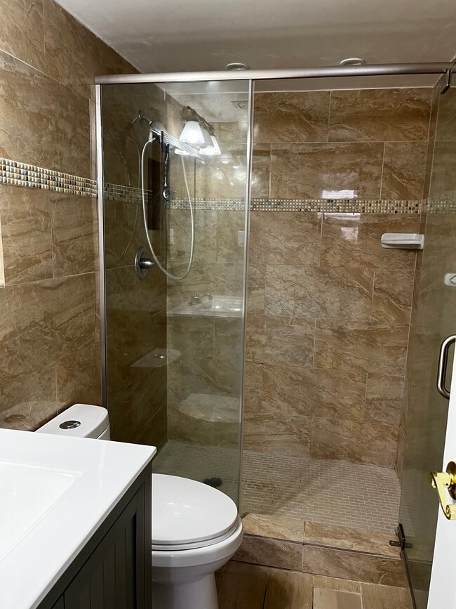 Renovated bathroom- marble - 1224 S Peninsula Dr