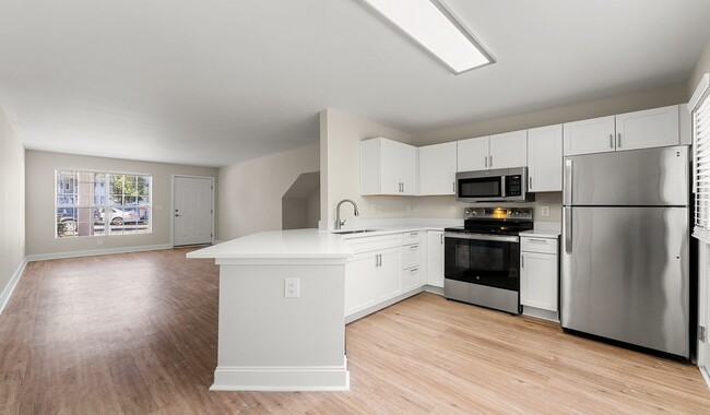 Open concept kitchens are great for hosting friends and family - Peachtree Park Apartments