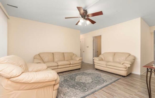 Spacious well lit living room with balcony access - 80 S Pleasant Rd