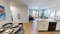 Located at 2139 Topside Rd in Alcoa, Tennessee, this single-floor residence offers a thoughtfully designed open-concept layout across two bedrooms and three full bathrooms. Warm hardwood-style flooring flows seamlessly throughout the home, creating a cohesive and inviting atmosphere.

The kitchen serves as a central hub, featuring granite countertops, white cabinetry, black appliances, and a peninsula with bar seating — ideal for casual dining or entertaining. Pendant lighting accents the workspace, while the open sightline connects the kitchen directly to the living and dining areas.

The living room is bright and welcoming, with multiple large windows and a glass-panel door that fills the space with natural light and provides access to a private balcony. A ceiling fan adds comfort overhead.

The generously sized primary bedroom offers a spacious retreat, complete with a ceiling fan and access to a dedicated closet with wire shelving systems for organized storage. The second bedroom is equally bright, benefiting from a large window with outdoor views and a ceiling fan. Each of the three bathrooms is finished with granite vanity countertops and hardwood-style flooring, with shower-tub combinations providing full functionality. The hallway connects all rooms efficiently, completing this clean and modern single-floor layout.