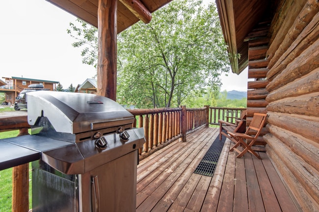 Building Photo - Charming Log Cabin and Carriage House – Do...