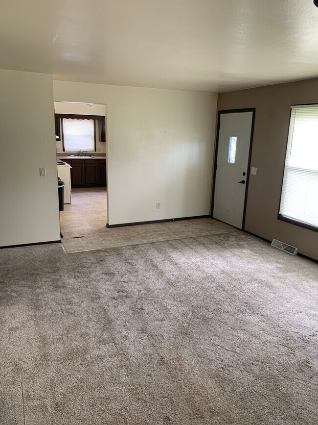 Living room facing kitchen - 210 S Wright Rd
