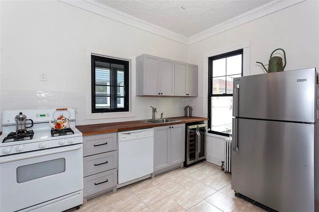 Large kitchen with all new appliances. Dishwasher and wine fridge. - 626 13th St