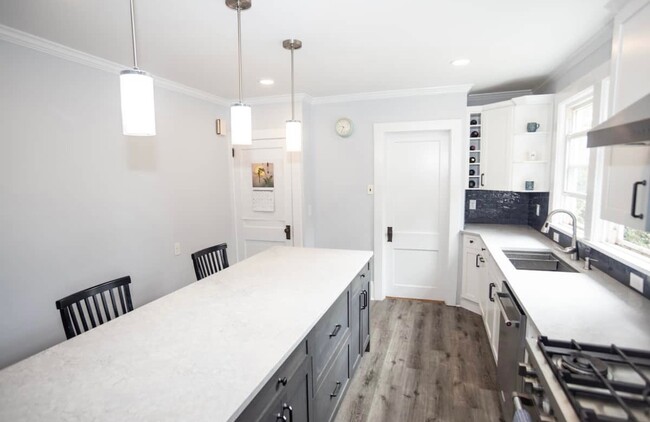 Newly renovated kitchen with open floor plan into dining room. - 181 Mills St