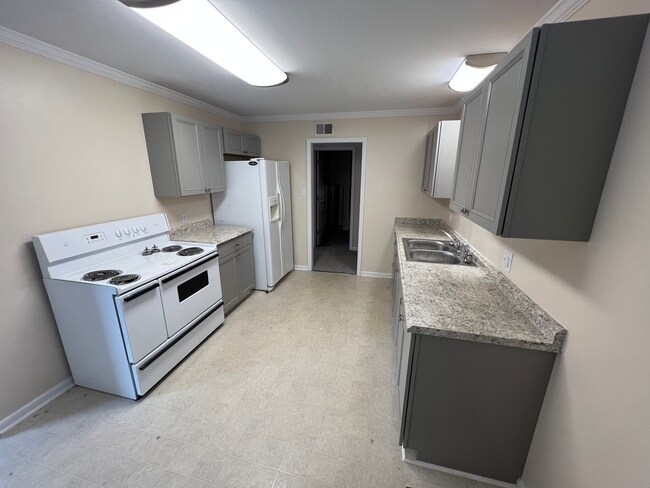 Kitchen view standing in dining area. - 307 Maple St