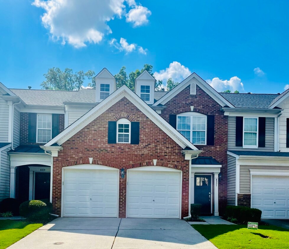 Outside view of the townhouse with 2 car garage. - 8321 Deckbar Pl