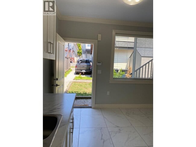 Building Photo - 717 E 61st Ave