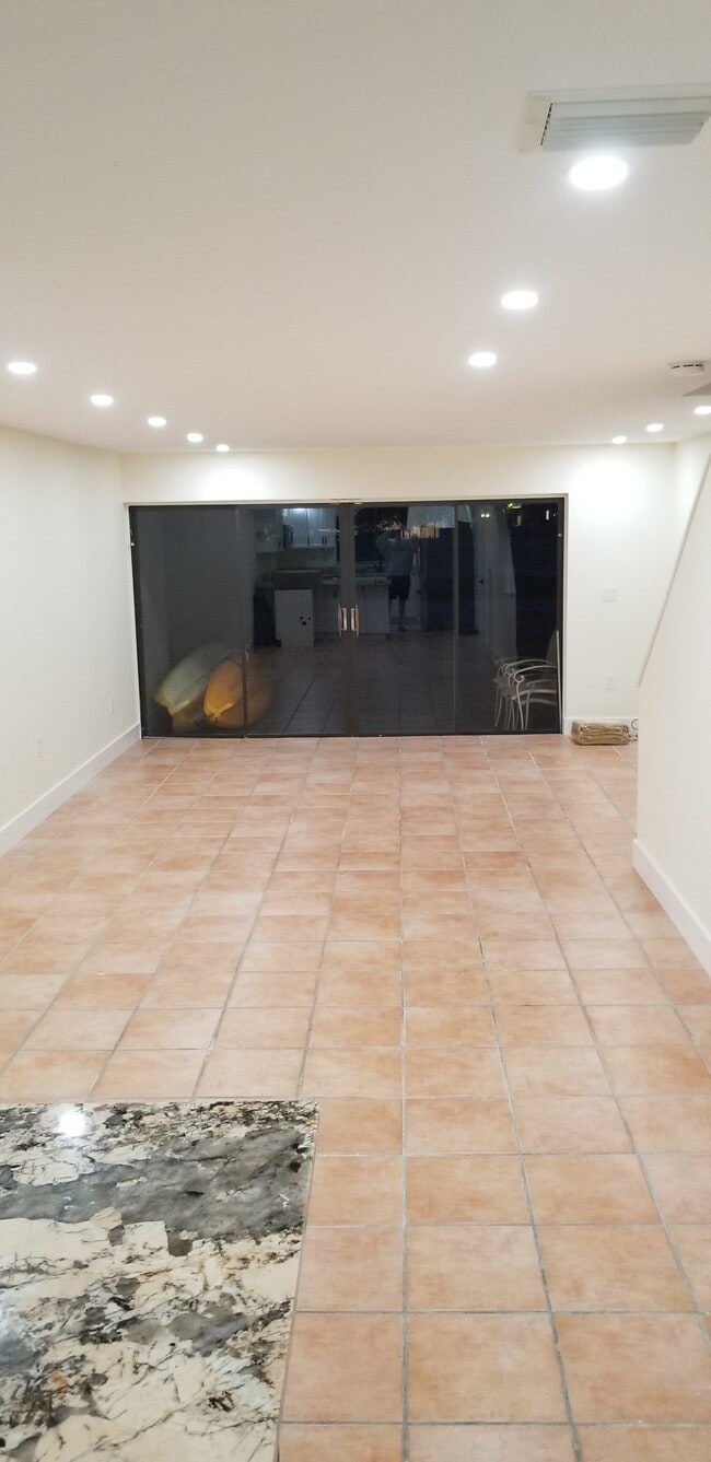 Living room at night - 1000 NW North River Dr