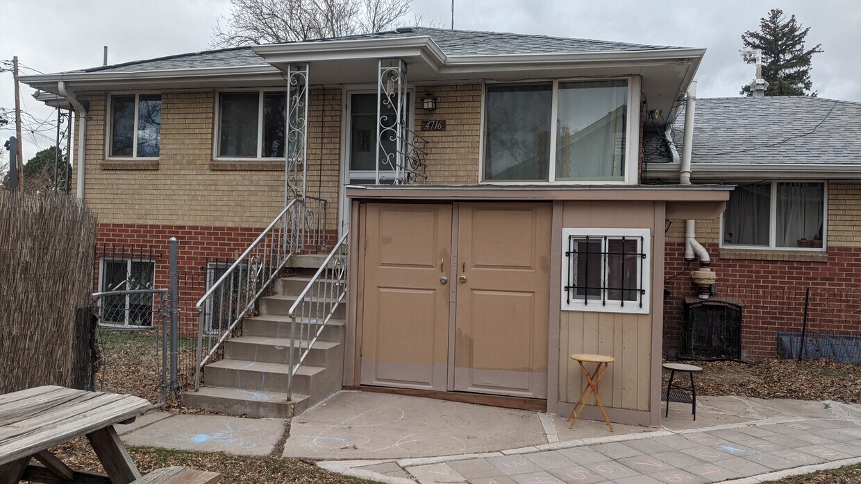 Front door upstairs with ground-level bicycle/stroller storage/stroller - 4716 W 10th Ave