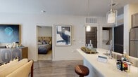 This efficiently designed single-floor residence offers a thoughtful layout across its 1 bedroom, 1 bathroom, closet, and open-concept kitchen and living area. The kitchen is a standout feature, outfitted with dark taupe cabinetry, quartz countertops, stainless steel appliances including a refrigerator, microwave, and range, and a peninsula island with pendant lighting that serves as both a workspace and casual dining area. Wood-style flooring runs throughout the main living spaces, adding warmth and continuity. The living room provides a comfortable gathering space with a ceiling fan, natural light from sliding glass doors, and enough room for a full seating arrangement. The bedroom offers plush carpeting, a ceiling fan, and windows dressed with floor-length curtains that allow for both light control and privacy. The bathroom features dark wood cabinetry, a single-sink vanity with a white countertop, a combination tub and shower, and direct access to a dedicated walk-in closet with built-in shelving. Throughout the space, neutral wall tones and clean architectural lines create a cohesive, modern aesthetic that balances functionality with comfortable, everyday living.