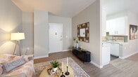 Located at 265 College St in New Haven, CT, this one-bedroom, one-bathroom unit offers a well-planned layout across a single floor. The living room serves as the heart of the space, featuring warm hardwood-style flooring, neutral-toned walls, and multiple windows that invite natural light. The open entry flows seamlessly into the living area, creating a welcoming and functional atmosphere.

The galley kitchen is thoughtfully designed with crisp white cabinetry, white quartz countertops, a green subway tile backsplash, stainless steel appliances including a refrigerator and range, and dark tile flooring — delivering both style and practicality in a compact footprint.

The bedroom is a comfortable retreat with hardwood-style flooring, a window providing natural light, and direct access to the main living area. Its neutral palette creates a calm and restful environment.

The bathroom features classic black-and-white mosaic tile flooring, white subway tile walls, a vanity with storage, and a full shower/tub combination, lending a timeless aesthetic to the space.

Throughout the unit, consistent neutral tones, clean finishes, and hardwood-style flooring create a cohesive and inviting ambiance, making this a practical and attractive residence in the heart of New Haven.
