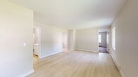 Located at 30 Black Creek Rd in Esopus, NY, this single-floor, 2-bedroom, 1-bathroom home offers a well-organized layout designed for comfortable everyday living. The open living room is bright and airy, finished with light-toned hardwood-style flooring and neutral walls that create a clean, welcoming atmosphere. Natural light filters in through multiple windows, enhancing the sense of space throughout.

The kitchen is thoughtfully designed with crisp white cabinetry, light stone-look countertops, a classic white subway tile backsplash, and stainless steel appliances including a range, over-the-range microwave, and refrigerator. A centered window above the sink adds natural light to the workspace.

Both bedrooms are carpeted for warmth and comfort, each featuring baseboard heating and window access to natural light. The primary bedroom includes a closet, and the layout accommodates a total of three closets throughout the home, providing ample storage. The full bathroom is clean and functional, featuring a full-size soaking tub with a showerhead combo and white fixtures.

The home's neutral color palette and light finishes throughout give it a fresh, move-in-ready feel, well suited for those seeking a practical and comfortable residence in the Hudson Valley region of New York.