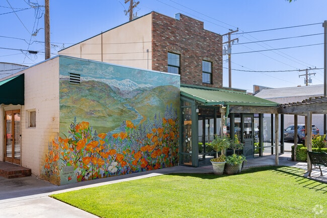 A lovely mural of the local California Poppies brighten up this cozy area in downtown Exeter.