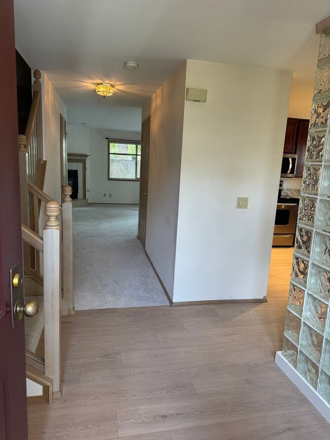 Building Photo - Privately placed, end unit townhome, brand...