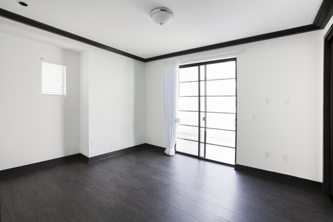 Bedroom with sliding door - 2131 S Beverly Glen Blvd