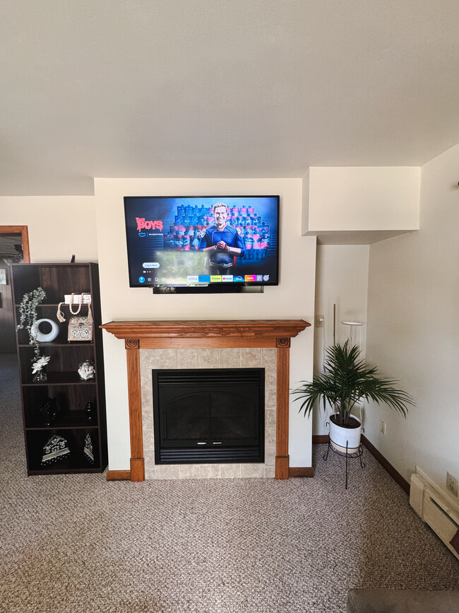 Shared cozy living room with a fireplace, comfortable seating, and a 50-inch TV with Prime, perfect - 815 Mount Vernon St