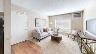 Located on Fair Oaks Blvd in Carmichael, CA, this 2-bedroom, 1-bathroom single-floor unit offers a practical and comfortable layout across a well-utilized footprint. The living room welcomes you with warm neutral tones, plush carpeting, a large window with blinds allowing ample natural light, and a textured ceiling. A wall-mounted A/C unit and a vertical heater provide year-round climate control.

The galley-style kitchen features white cabinetry, granite-style countertops, a stainless steel sink, and hardwood flooring, with full appliances including a refrigerator, range, and dishwasher. The kitchen opens to a casual dining area.

The spacious primary bedroom offers plush carpeting, a ceiling fan, and a window overlooking the exterior, providing good natural light. The second bedroom is equally well-appointed, featuring a ceiling fan, large sliding-door closet, and carpeted flooring. Both rooms are finished in soft, neutral tones.

The bathroom is thoughtfully designed with rich hardwood flooring, a granite-topped vanity with white cabinetry, and a separate water closet with a shower-tub combination. A hallway and closet complete the layout, offering additional storage throughout the unit.