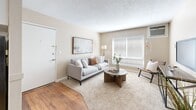 Located on Fair Oaks Blvd in Carmichael, CA, this 2-bedroom, 1-bathroom single-floor unit offers a practical and comfortable layout across a well-utilized footprint. The living room welcomes you with warm neutral tones, plush carpeting, a large window with blinds allowing ample natural light, and a textured ceiling. A wall-mounted A/C unit and a vertical heater provide year-round climate control.

The galley-style kitchen features white cabinetry, granite-style countertops, a stainless steel sink, and hardwood flooring, with full appliances including a refrigerator, range, and dishwasher. The kitchen opens to a casual dining area.

The spacious primary bedroom offers plush carpeting, a ceiling fan, and a window overlooking the exterior, providing good natural light. The second bedroom is equally well-appointed, featuring a ceiling fan, large sliding-door closet, and carpeted flooring. Both rooms are finished in soft, neutral tones.

The bathroom is thoughtfully designed with rich hardwood flooring, a granite-topped vanity with white cabinetry, and a separate water closet with a shower-tub combination. A hallway and closet complete the layout, offering additional storage throughout the unit.