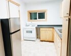 beautiful kitchen with Gas Range, brand new refrigerator and solid surface countertops - 185 High St