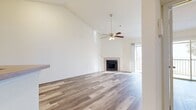 This 560 square foot apartment in Sanford, FL, offers a well-designed living space on a single floor. The open-concept layout maximizes the available area, creating a seamless flow between the living room and kitchen. The living area features high ceilings with a modern ceiling fan, enhancing the sense of spaciousness. Throughout the apartment, attractive wood-look flooring adds warmth and durability.

The kitchen, while compact, is efficiently designed with wooden cabinetry, stainless steel appliances, and a practical layout. The bedroom, measuring 130 square feet, includes a ceiling fan and access to a private balcony, providing natural light and outdoor views. A closet with a bright yellow interior offers ample storage space.

The bathroom is equipped with essential fixtures, including a combined bathtub and shower. The apartment's neutral color palette, predominantly white walls, creates a bright and airy ambiance. This one-bedroom unit is ideal for individuals or couples seeking a low-maintenance, modern living space in a convenient Florida location.