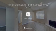 This contemporary apartment offers 780 square feet of thoughtfully designed living space. The layout includes two bedrooms, two bathrooms, and an open-concept kitchen and living area. The primary bedroom, measuring 150 square feet, provides ample space for relaxation.

The interior showcases a neutral color palette with light gray walls, creating a bright and airy ambiance. Wood-look flooring runs throughout, adding warmth and durability. The living room features a sleek fireplace with a marble-like surround, perfect for cozy evenings. Large windows allow natural light to flood the space, while ceiling fans ensure comfortable air circulation.

The updated kitchen boasts white cabinetry, stainless steel appliances, and quartz countertops. A breakfast bar provides additional seating and seamlessly connects the kitchen to the living area. Sliding glass doors lead to a balcony, offering outdoor space for relaxation or entertaining.

Both bathrooms feature modern fixtures and finishes, with one showcasing a stylish walk-in shower. The apartment's efficient design includes a hallway and closet space for added storage. Located in Indianapolis, this well-appointed apartment combines comfort and style in a compact, urban setting.