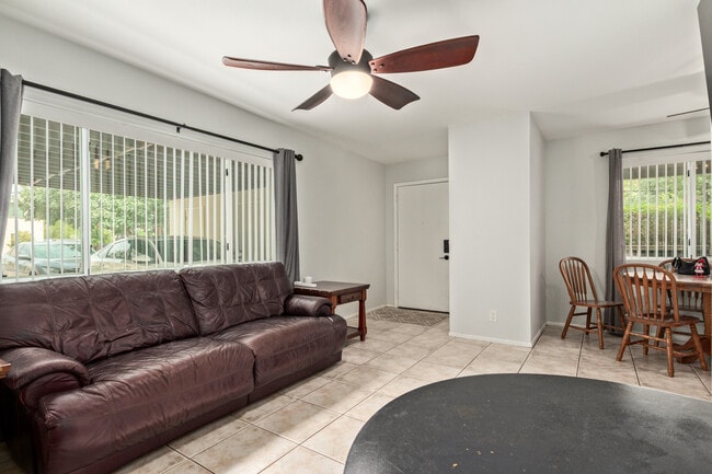 Living room with front door entrance - 115 W 10th St