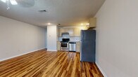 Located at 514 Finks Hideaway Rd in Monroe, Louisiana, this single-story one-bedroom, one-bathroom unit offers a practical and comfortable layout that makes efficient use of its space. Rich wood-look flooring flows consistently throughout every room, lending a warm, cohesive aesthetic across the entire unit.

The open kitchen and living area form the heart of the home. The kitchen is outfitted with stainless steel appliances — including a refrigerator, electric range, and dishwasher — complemented by light-toned cabinetry, granite-style countertops, and a classic white subway tile backsplash. Recessed lighting and under-cabinet ventilation add both function and polish to this well-equipped space.

The living area provides an open, airy feel with neutral gray walls and a textured ceiling, offering a versatile canvas for a variety of furnishing arrangements. Natural light enters through a window fitted with blinds.

The bedroom is generously sized, featuring a ceiling fan with light fixture, a window for natural light, and direct access to both a closet and the bathroom. The layout also includes a utility panel conveniently located within the bedroom.

The bathroom is neatly finished with a granite-topped vanity, light wood cabinetry, a framed mirror, and a full tub-shower combination — all tied together by the same wood-look flooring found throughout the unit.