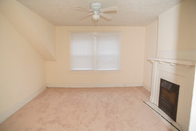 Front bedroom with a faux fire place - 703 Midland St