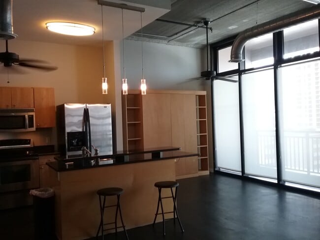 Kitchen area with built in Murphy Bed - 175 2nd St S