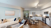 Located at 703 Baywood Dr in Petaluma, CA, this thoughtfully designed one-bedroom, one-bathroom residence offers an efficient and well-appointed single-level layout. The open-concept living and dining area flows seamlessly into the kitchen, creating a bright, connected space ideal for everyday living. Large windows invite abundant natural light into the living room, which features wood-look flooring and a soft, neutral color palette accented by cool blue tones. The modern kitchen is equipped with stainless steel appliances, sleek white cabinetry extending to the ceiling, under-cabinet lighting, and a contemporary countertop, offering both style and functionality. A dedicated office space with sage-green walls provides a calm, focused environment for work or study. The bedroom features plush carpeting, a bold teal accent wall, a sliding barn-style closet door, and a window that fills the room with natural light. The full bathroom includes a tub-shower combination with a clean, neutral finish. Wood-look flooring, track lighting, and a cohesive coastal-inspired design aesthetic tie the entire residence together, creating a comfortable and modern living environment.