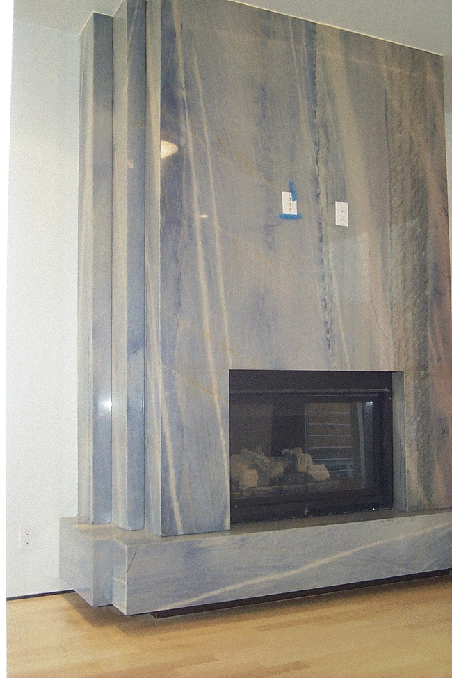 Large Azul Mcauba granite gas fireplace in lounge room - 12A Reno Pl