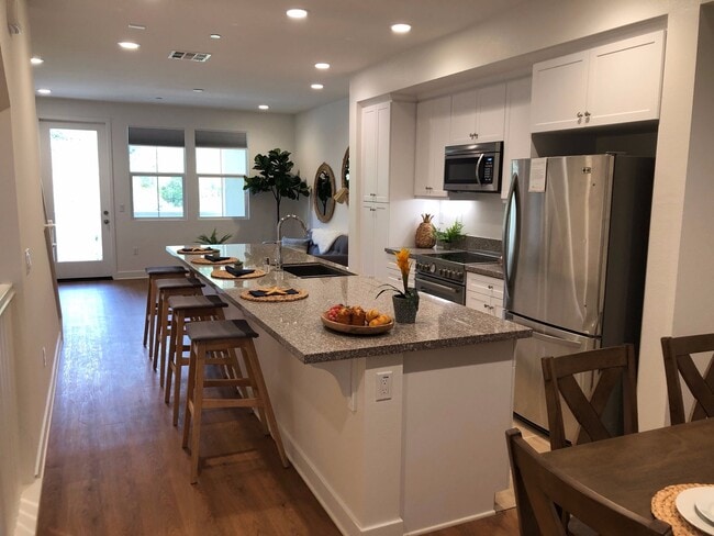 Building Photo - Gorgeous 4 bed/4 bath w/2 car garage in new community w/pool less than 1 mile to the beach!