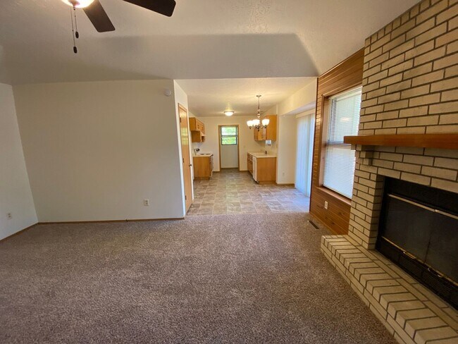 Building Photo - Three bedroom, two bathroom, two car garag...