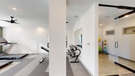 Located at 10 Calm Water Dr in Asheville, NC, this fitness center offers a thoughtfully designed exercise facility spread across a single floor. The space is defined by a clean, modern aesthetic, featuring bright white walls accented by sage green focal walls, recessed lighting, and multiple ceiling fans that ensure comfortable airflow throughout workouts.

The main exercise room is divided into functional zones. The cardio area is equipped with multiple treadmills, an elliptical trainer, and stationary bikes, positioned alongside large windows fitted with blinds that allow ample natural light while offering privacy. A wall-mounted flat-screen television accompanies this section for entertainment during cardio sessions.

A dedicated free weights area features a full dumbbell rack with a large wall mirror, providing users with proper form visibility. Adjacent to this, a stability and functional training zone houses medicine balls, stability balls, and a multi-use cable machine. The flooring throughout consists of interlocking foam and rubber tiles, offering cushioning and safety across all training zones.

The hallway entry, accessible via a full-length glass sliding door, provides a clean transition into the facility. Decorative touches, including framed artwork and small potted plants, contribute to an inviting atmosphere. The space is well-lit, well-ventilated, and comprehensively equipped to support a wide range of fitness activities.