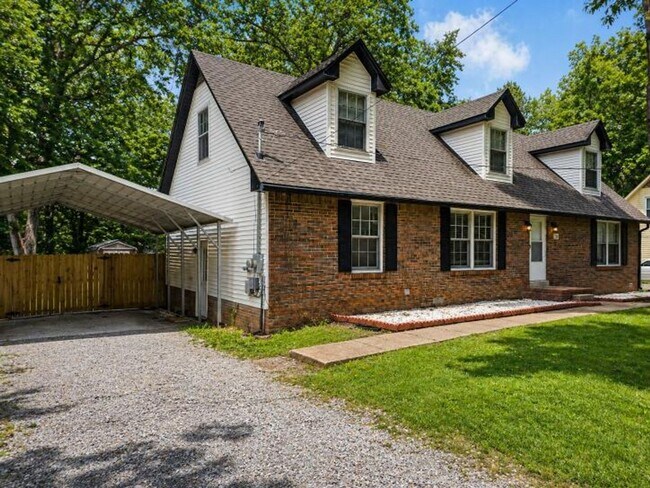 Building Photo - Welcome home to the perfect blend of peaceful country charm and modern city living!
