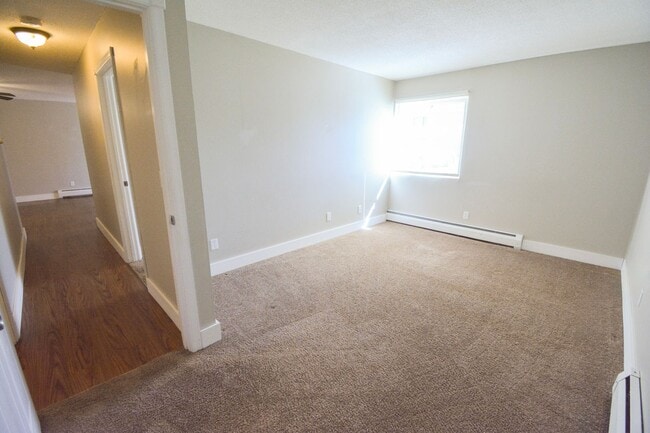 Building Photo - Main floor condo with great patio & many u...
