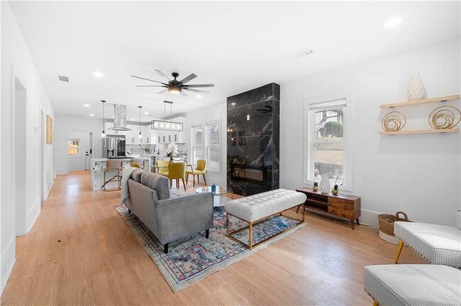 Open concept living room. Built in fireplace. - 2415 Main St NW