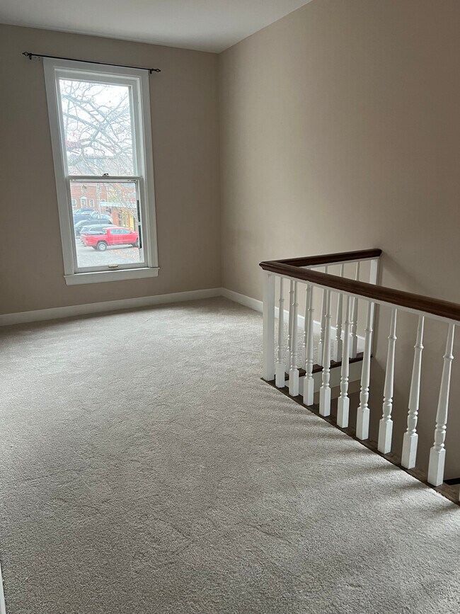 Top of stair entry - 215 W 3rd St