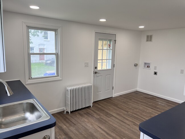 Kitchen and side porch entrance door with laundry hookups - 3643 Ransomville Rd