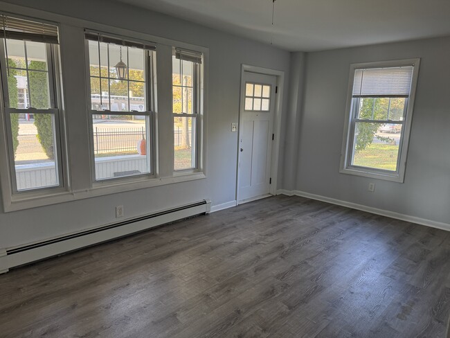 Sunny Living Room looks out on front porch - 827 Woodward Ave