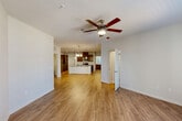 Located at 1931 Chemin Metairie Rd in Youngsville, Louisiana, this well-appointed single-story home offers three bedrooms, two full bathrooms, and a thoughtfully designed open-concept floor plan. The living, dining, and kitchen areas flow seamlessly together, anchored by warm wood-look flooring and filled with natural light from French doors that lead to the exterior. Ceiling fans are present throughout the home, adding both function and comfort.

The kitchen is a standout feature, boasting rich dark cabinetry, granite countertops, a center island with a undermount sink, pendant lighting, and a full suite of stainless steel appliances including a refrigerator, range, and microwave. Recessed lighting enhances the bright, clean aesthetic.

The bedrooms are carpeted for comfort and each includes a ceiling fan. The primary bedroom offers a generous layout with ample closet space. Both bathrooms are finished with granite-topped vanities and dark wood cabinetry; the larger bathroom features a dual-sink vanity and a tub-shower combo, while the second bathroom maintains a clean, functional design.

A dedicated laundry room houses a full-size washer and dryer. With five closets throughout, storage is plentiful. The home presents a modern, move-in-ready interior with cohesive finishes from room to room.