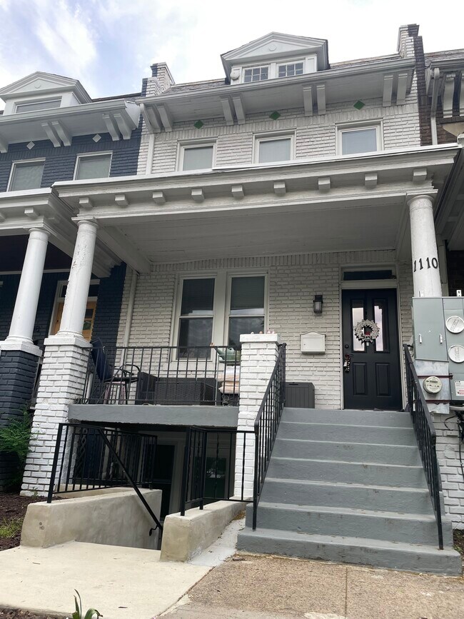 Enjoy a large front porch on this classic rowhouse street. - 1110 4th St NE