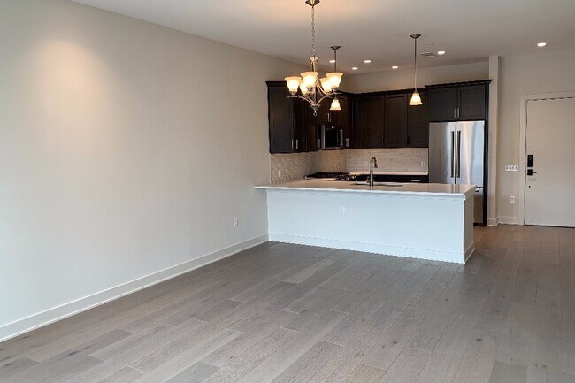 Large living room with high ceilings - 575 S Goddard Blvd