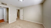 Located at Harbor Pointe in Sandy Springs, GA, this one-bedroom, one-bathroom residence offers a well-organized layout across a single floor. The galley-style kitchen is a functional highlight, featuring crisp white cabinetry, dark granite-style countertops, a stainless steel refrigerator, dishwasher, and a double basin sink — all set atop warm wood-look flooring that lends a clean, modern feel to the space. The open-concept living area flows naturally from the kitchen, bathed in natural light through sliding glass doors. The bedroom is a comfortable, carpeted retreat with neutral sage-toned walls, a window dressed with horizontal blinds that invites ample daylight, and direct access to the bathroom and closet. The bathroom continues the granite-style countertop aesthetic, featuring a wide vanity with white cabinetry, dual mirrors, and a well-lit sink area. A dedicated closet off the bathroom provides convenient storage. Throughout the unit, textured ceilings, clean white trim, and a neutral color palette create a cohesive and inviting ambiance, making this a practical and move-in-ready home in the Sandy Springs community.