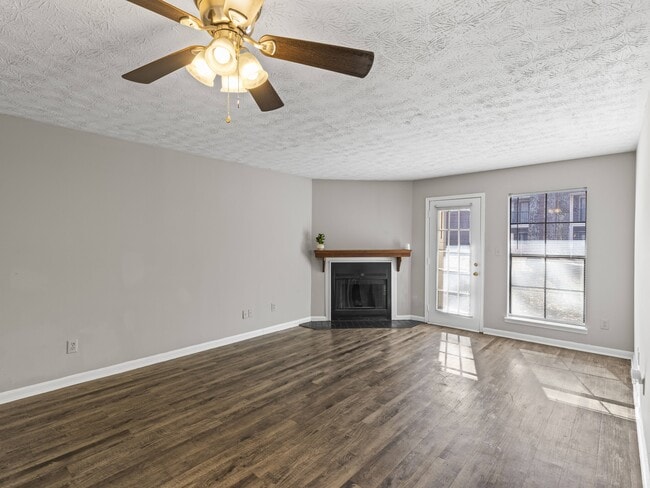 Our Montgomery apartments at Stratford Village feature cozy rooms with fireplaces and ceiling fan comfort, professionally operated by Highlands Vista Group. - Stratford Village