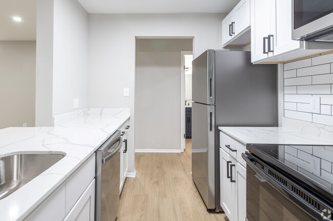 Reimagined kitchen with custom shaker style cabinetry and black pulls - Autumn Columbia